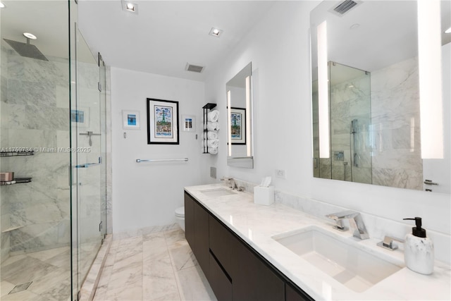 1451 Brickell Ave Unit 4002, Miami, FL 33131 - bathroom with a marble finish shower, double vanity, marble finish floors, and toilet