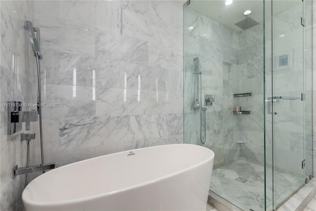1451 Brickell Ave Unit 4002, Miami, FL 33131 - full bathroom with a marble finish shower and a freestanding tub