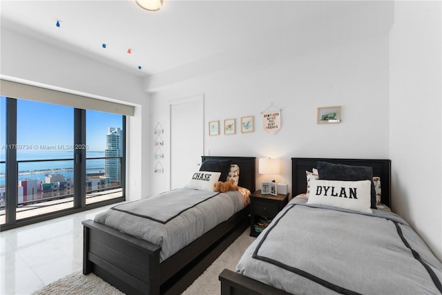 1451 Brickell Ave Unit 4002, Miami, FL 33131 - bedroom featuring a water view and access to outside