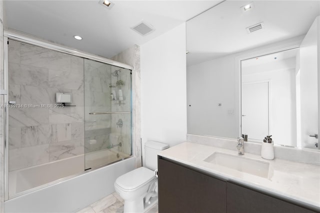 1451 Brickell Ave Unit 4002, Miami, FL 33131 - bathroom with vanity, toilet, combined bath / shower with glass door, marble finish flooring, and recessed lighting