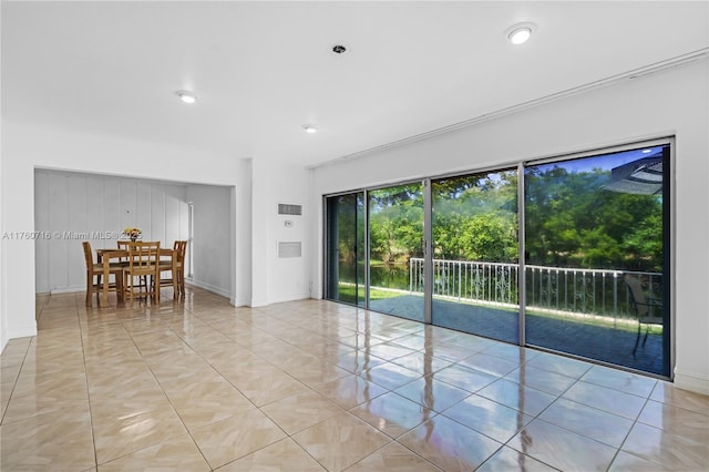 empty room featuring recessed lighting, visible vents, and baseboards