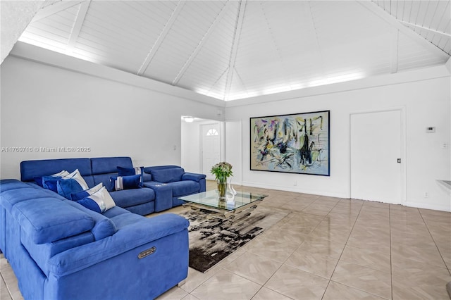 tiled living room featuring baseboards, high vaulted ceiling, wooden ceiling, and beam ceiling