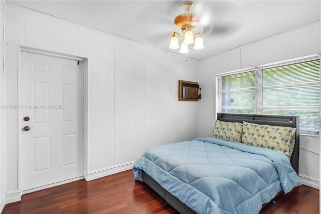 bedroom featuring wood finished floors and ceiling fan