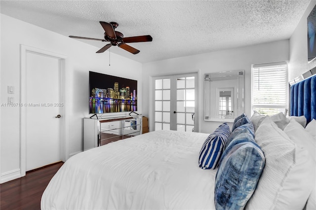 bedroom with french doors, a textured ceiling, ceiling fan, and dark wood-style flooring