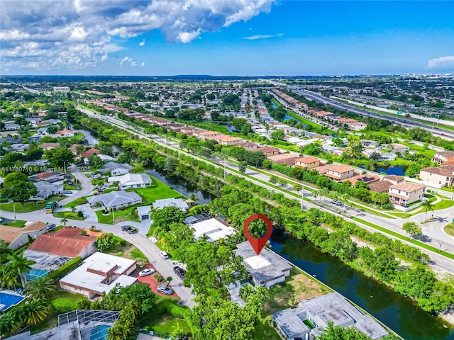 bird's eye view featuring a water view and a residential view