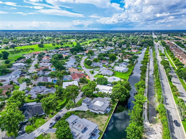drone / aerial view featuring a residential view and a water view
