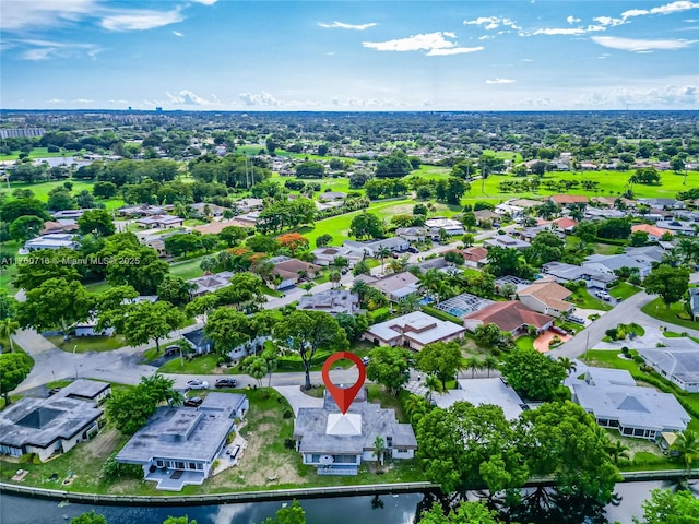 drone / aerial view with a water view and a residential view