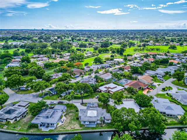 drone / aerial view with a water view and a residential view