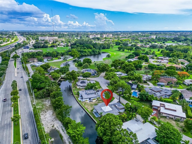 birds eye view of property with a residential view and a water view