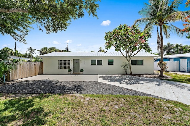 367 W Riverside Dr, Tequesta, FL 33469 - back of house with stucco siding and a patio area