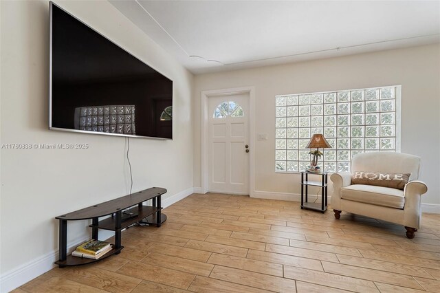 367 W Riverside Dr, Tequesta, FL 33469 - foyer featuring baseboards and wood finished floors