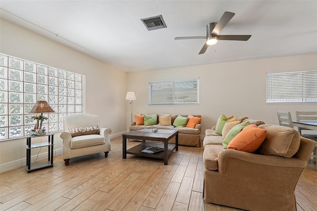 367 W Riverside Dr, Tequesta, FL 33469 - living room featuring light wood finished floors and ceiling fan