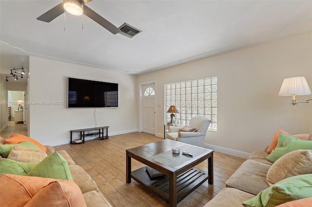 367 W Riverside Dr, Tequesta, FL 33469 - living room featuring light wood-style flooring and a ceiling fan