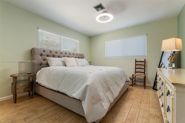 367 W Riverside Dr, Tequesta, FL 33469 - bedroom with light wood-style flooring and baseboards