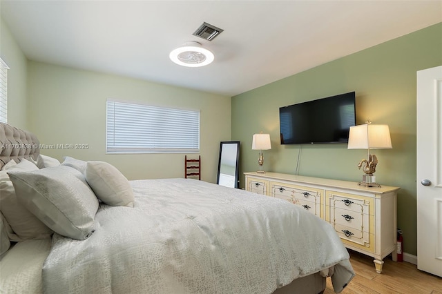 367 W Riverside Dr, Tequesta, FL 33469 - bedroom with light wood finished floors and baseboards