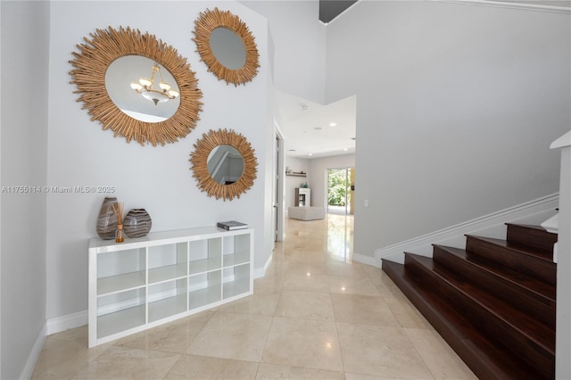 hall featuring tile patterned flooring, baseboards, a chandelier, stairway, and recessed lighting