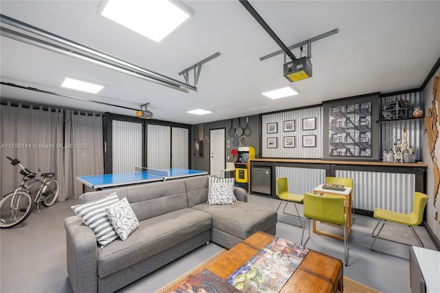 game room featuring concrete flooring and a garage