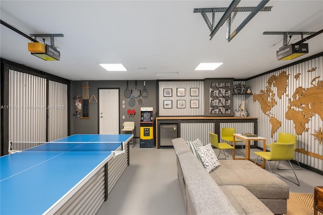 recreation room featuring a garage and concrete floors