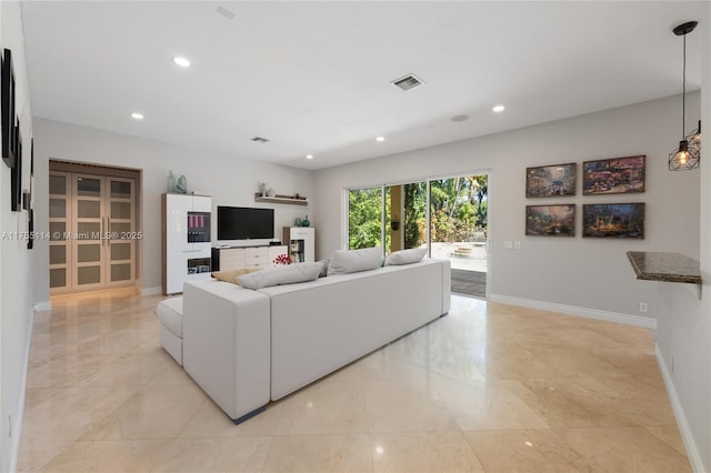 living area featuring marble finish floor, baseboards, visible vents, and recessed lighting