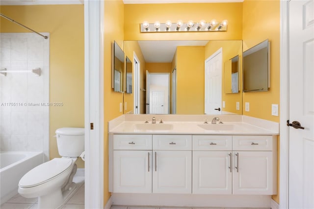 bathroom featuring double vanity, toilet, shower / tub combination, and a sink
