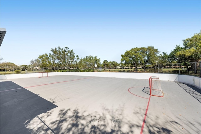 view of property's community featuring fence