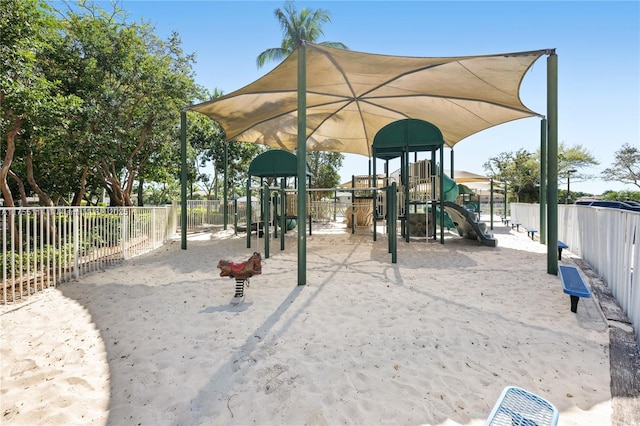 community jungle gym featuring fence