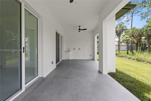 view of patio featuring a ceiling fan