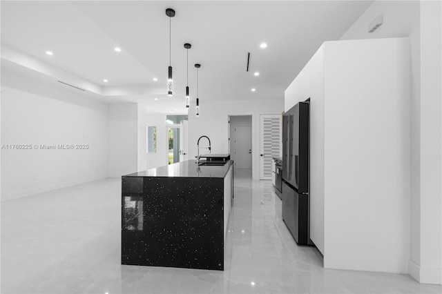 kitchen featuring white cabinetry, modern cabinets, recessed lighting, and a sink