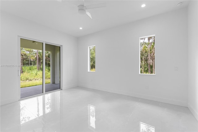 empty room featuring a wealth of natural light, baseboards, and recessed lighting