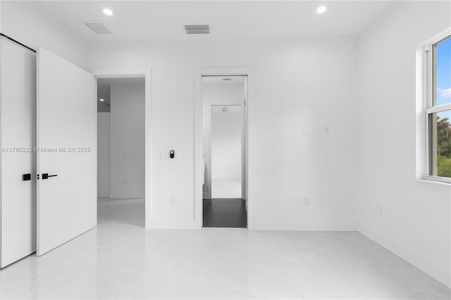 unfurnished bedroom featuring recessed lighting, visible vents, and multiple windows