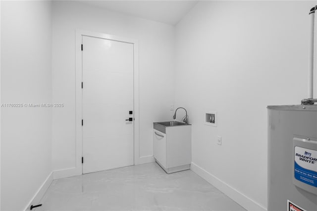 washroom with a sink, electric water heater, baseboards, hookup for a washing machine, and laundry area