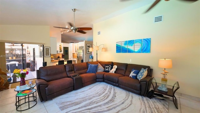 living room with light tile patterned floors, visible vents, high vaulted ceiling, and a ceiling fan