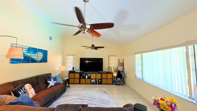 living room with tile patterned floors, visible vents, and lofted ceiling