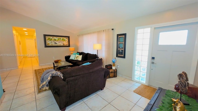 living area with lofted ceiling and light tile patterned flooring