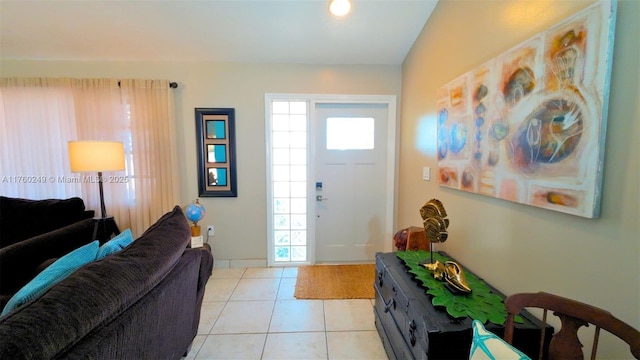 entrance foyer featuring light tile patterned floors and a wealth of natural light