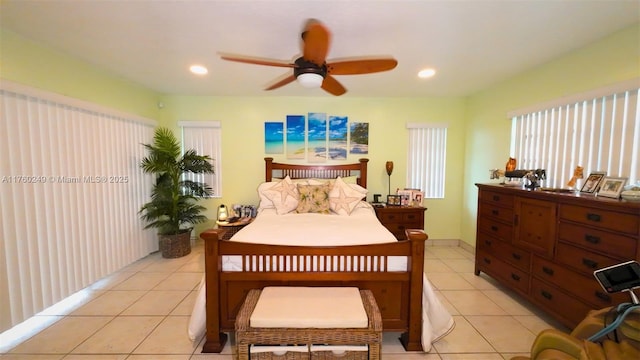 bedroom with light tile patterned floors, a ceiling fan, and recessed lighting