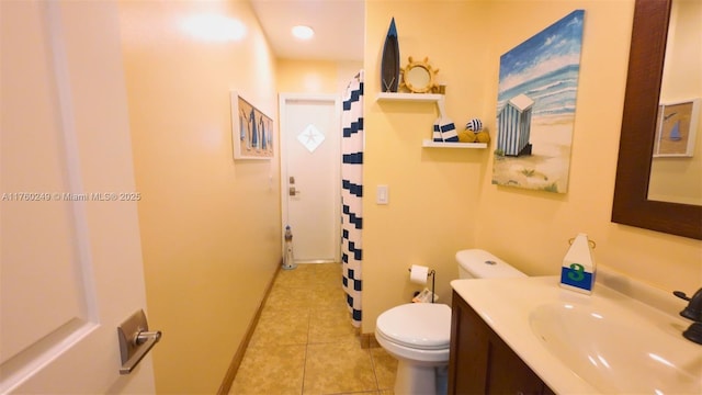 bathroom featuring vanity, tile patterned floors, toilet, and a shower with curtain