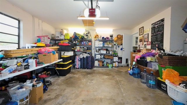 garage with a workshop area and a garage door opener