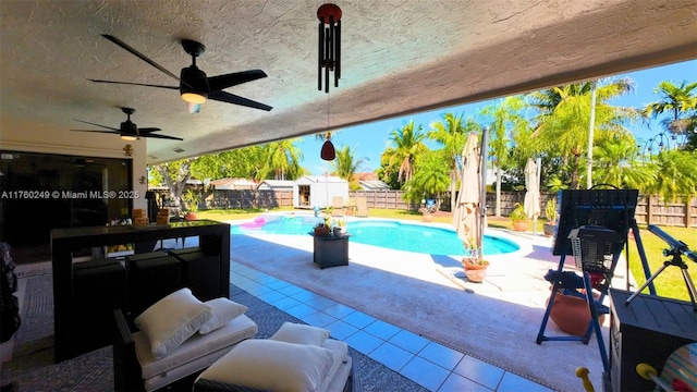 view of swimming pool featuring a fenced in pool, a fenced backyard, and a patio area