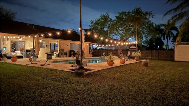 exterior space with a patio, a yard, and a fenced backyard