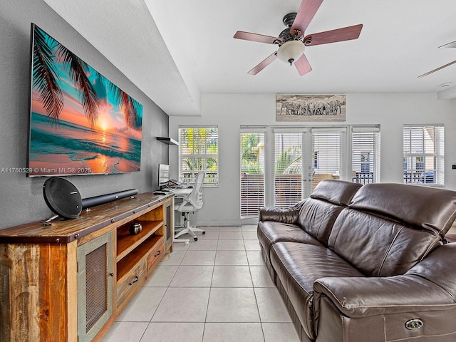 living room with light tile patterned floors, a healthy amount of sunlight, french doors, and ceiling fan