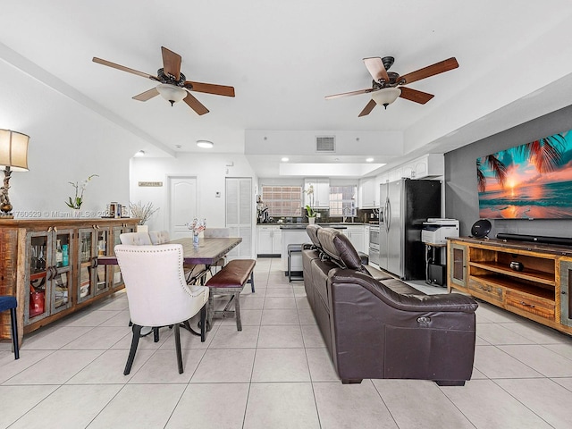 living room with light tile patterned flooring, visible vents, recessed lighting, and a ceiling fan