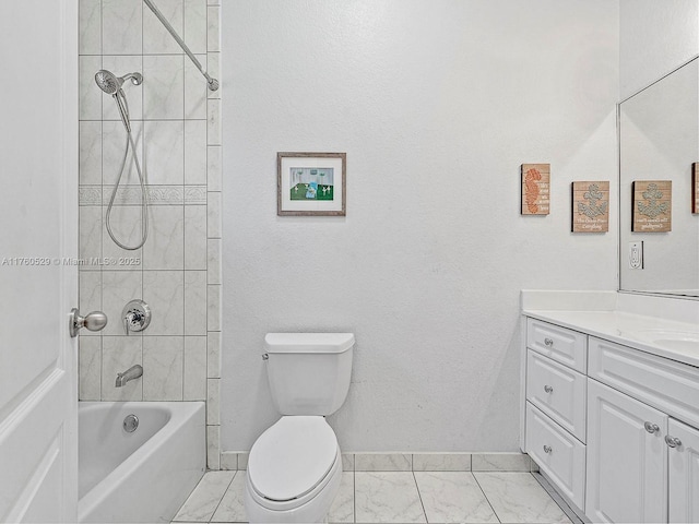 full bathroom with toilet, marble finish floor, shower / washtub combination, baseboards, and vanity