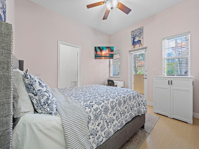 bedroom featuring baseboards, a ceiling fan, and light wood finished floors