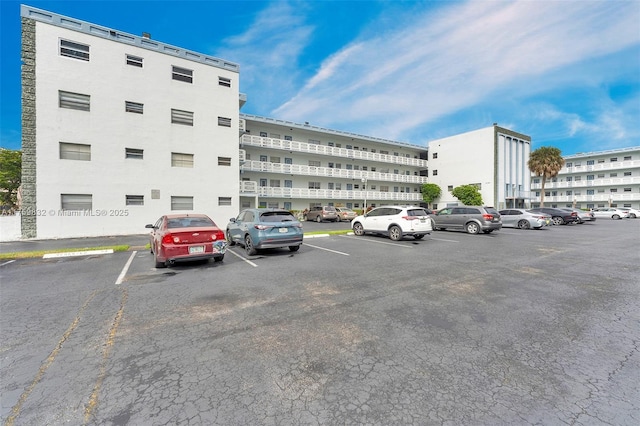 view of property featuring uncovered parking