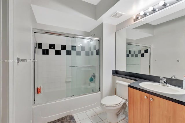 full bath featuring visible vents, toilet, tile patterned floors, vanity, and enclosed tub / shower combo