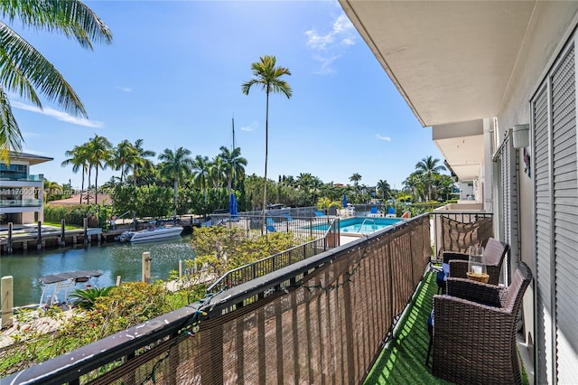 balcony featuring a water view