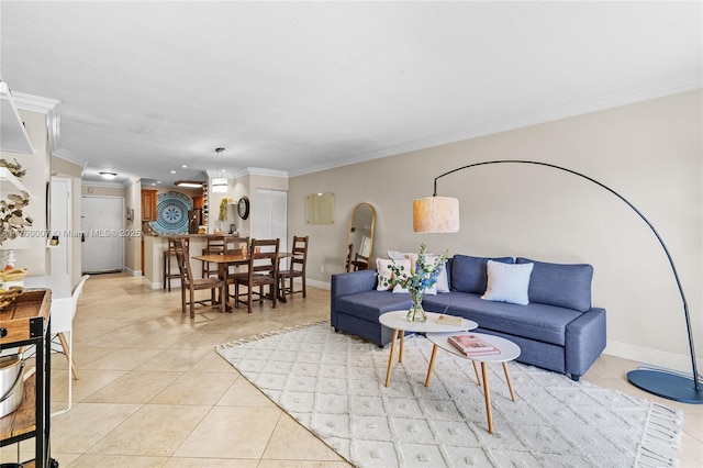 living room with light tile patterned floors, arched walkways, crown molding, and baseboards