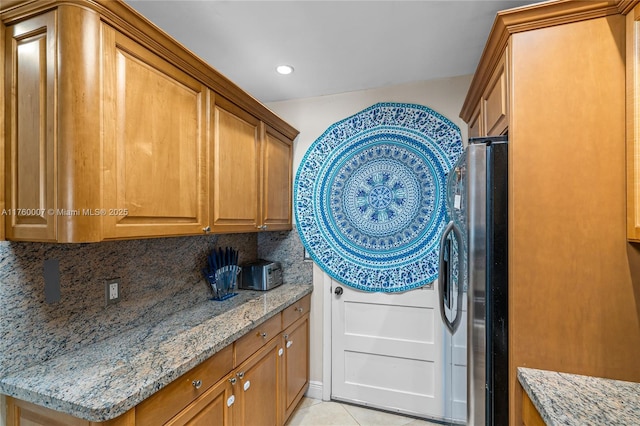 laundry area featuring recessed lighting, light tile patterned flooring, and laundry area