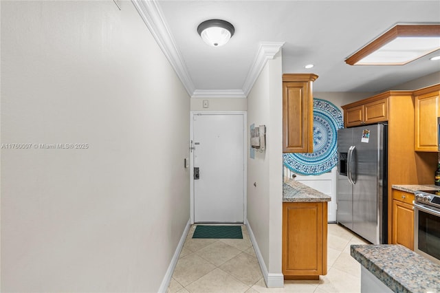 doorway to outside featuring light tile patterned floors, baseboards, and ornamental molding